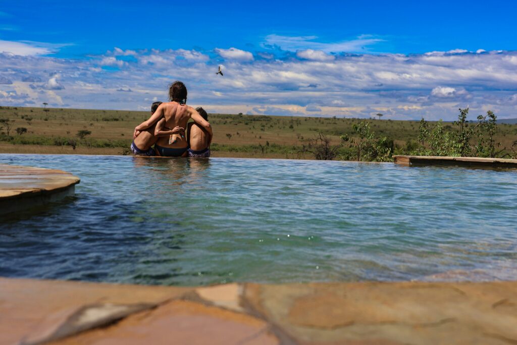a couple of people that are sitting in a pool a couple of people that are sitting in a pool