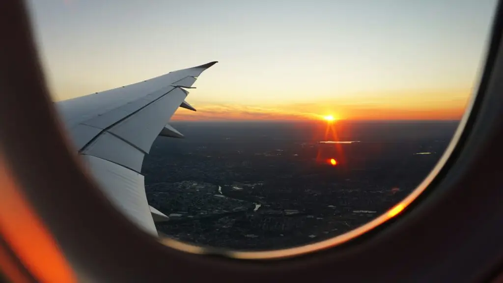 airplanes window view of sky during golden hour airplanes window view of sky during golden hour